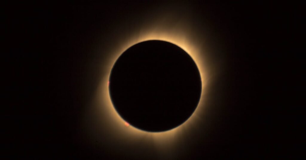 A captivating view of a solar eclipse highlighting the glowing corona in a dark sky.